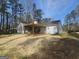 Backyard with screened porch and patio featuring an outdoor grill at 5802 Bay Pointe Sound Nw, Acworth, GA 30101