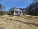Charming single-story home featuring a large yard, screened porch and outdoor cooking area at 5802 Bay Pointe Sound Nw, Acworth, GA 30101