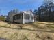 Charming single-story home featuring a large yard and screened porch at 5802 Bay Pointe Sound Nw, Acworth, GA 30101