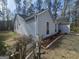 View of the side of the home showing mulched beds at 5802 Bay Pointe Sound Nw, Acworth, GA 30101