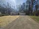 Charming single-story home featuring a two-car garage and a well-manicured front yard at 5802 Bay Pointe Sound Nw, Acworth, GA 30101
