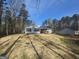 Backyard with screened porch and patio featuring an outdoor grill at 5802 Bay Pointe Sound Nw, Acworth, GA 30101