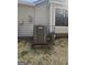 Image of a Lennox HVAC unit that is positioned alongside the house at 5802 Bay Pointe Sound Nw, Acworth, GA 30101