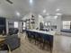 Bright, open kitchen with a large island, stainless steel appliances, and seamless flow to living area at 5802 Bay Pointe Sound Nw, Acworth, GA 30101