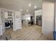 Open concept kitchen with island, stainless appliances, and seamless transition to living area at 5802 Bay Pointe Sound Nw, Acworth, GA 30101
