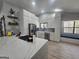 Stylish kitchen with white cabinetry, stainless steel appliances, and a cozy window bench at 5802 Bay Pointe Sound Nw, Acworth, GA 30101