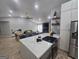 Bright, open-concept kitchen with a large island, perfect for cooking and entertaining at 5802 Bay Pointe Sound Nw, Acworth, GA 30101