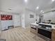 Open concept kitchen with breakfast bar, stainless oven/cooktop and access to other rooms at 5802 Bay Pointe Sound Nw, Acworth, GA 30101