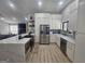 Modern kitchen featuring white cabinets, stainless steel appliances, and open layout at 5802 Bay Pointe Sound Nw, Acworth, GA 30101