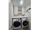 Charming laundry room with modern appliances, stylish decor, and functional shelving at 5802 Bay Pointe Sound Nw, Acworth, GA 30101