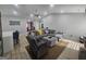 Spacious living room featuring a plush gray sectional, vaulted ceiling, and inviting atmosphere at 5802 Bay Pointe Sound Nw, Acworth, GA 30101