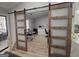 Bright office space with natural light, wood floors, and sliding barn doors for privacy at 5802 Bay Pointe Sound Nw, Acworth, GA 30101
