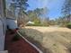 Spacious yard showing landscaping and a large driveway at 5802 Bay Pointe Sound Nw, Acworth, GA 30101