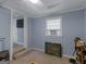 Bedroom area complete with window AC unit and carpeted flooring at 1202 Coan Dr, Locust Grove, GA 30248