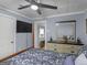 Bedroom with bed, dresser, and ceiling fan at 1202 Coan Dr, Locust Grove, GA 30248