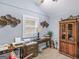 Bedroom includes a desk, cabinet, and a window for natural light at 1202 Coan Dr, Locust Grove, GA 30248