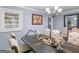 Elegant dining room with wooden table and decor at 1202 Coan Dr, Locust Grove, GA 30248