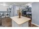 Bright kitchen with white cabinets, laundry, and island at 1202 Coan Dr, Locust Grove, GA 30248