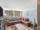 Spacious living room with large windows and comfortable seating at 1202 Coan Dr, Locust Grove, GA 30248
