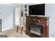 Cozy living area with fireplace and mounted television at 1202 Coan Dr, Locust Grove, GA 30248