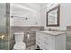 Modern bathroom with updated vanity, marble countertop, tiled accent wall, bronze fixtures, and glass shower doors at 280 Nutt Dr, Locust Grove, GA 30248