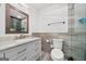 Modern bathroom with updated vanity, marble countertop, tiled accent wall, bronze fixtures, and glass shower doors at 280 Nutt Dr, Locust Grove, GA 30248