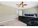 Bedroom featuring plush carpeting, neutral walls, ceiling fan, and a large window at 280 Nutt Dr, Locust Grove, GA 30248