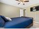 Bedroom features a queen-sized bed with a ceiling fan and wall mounted TV at 280 Nutt Dr, Locust Grove, GA 30248