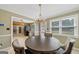 Charming dining room with a round table and elegant chandelier at 280 Nutt Dr, Locust Grove, GA 30248