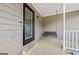 Cozy front porch with swing, decorative door, and space to unwind and relax at 280 Nutt Dr, Locust Grove, GA 30248