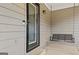 Inviting covered front porch with a porch swing and glass panel front door at 280 Nutt Dr, Locust Grove, GA 30248