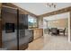 Bright kitchen with stainless steel appliances, granite counters, and stone backsplash, next to open dining area at 280 Nutt Dr, Locust Grove, GA 30248