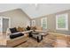 Bright living room with ample seating, stylish rug, and open layout at 280 Nutt Dr, Locust Grove, GA 30248