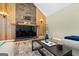 Cozy living room featuring a stone fireplace and sleek glass coffee table at 280 Nutt Dr, Locust Grove, GA 30248