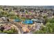 A high aerial captures community amenities including tennis courts, pool, and playground at 3149 Hidden Falls Ne Dr, Buford, GA 30519