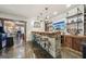 Basement bar area with beverage cooler, shelving, and TV at 3149 Hidden Falls Ne Dr, Buford, GA 30519