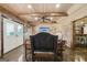Basement area featuring exposed beams, TV, chairs, and a bar space at 3149 Hidden Falls Ne Dr, Buford, GA 30519
