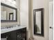 Bathroom featuring granite countertop and framed mirror at 3149 Hidden Falls Ne Dr, Buford, GA 30519