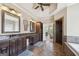Bathroom with double vanities, tile floors, and a walk-in shower at 3149 Hidden Falls Ne Dr, Buford, GA 30519