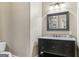 Bathroom with granite countertop and black vanity at 3149 Hidden Falls Ne Dr, Buford, GA 30519
