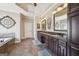 Spacious bathroom with double vanities, soaking tub, and decorative accents at 3149 Hidden Falls Ne Dr, Buford, GA 30519