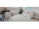 Cozy bedroom with plush carpet, a comfortable sofa, and a bright window with natural light at 3149 Hidden Falls Ne Dr, Buford, GA 30519