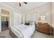 Bedroom featuring a decorative headboard and natural light at 3149 Hidden Falls Ne Dr, Buford, GA 30519