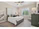Bedroom with ceiling fan and a large window at 3149 Hidden Falls Ne Dr, Buford, GA 30519