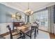 Dining room with large windows providing ample natural light and a view to the neighborhood at 3149 Hidden Falls Ne Dr, Buford, GA 30519