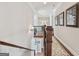 Elegant hallway features hardwood floors, ornate molding and a decorative stair runner at 3149 Hidden Falls Ne Dr, Buford, GA 30519