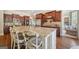 Spacious kitchen boasts cherry cabinets, granite countertops, and stainless steel appliances at 3149 Hidden Falls Ne Dr, Buford, GA 30519