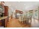 Open concept kitchen with a large island, hardwood floors and modern appliances at 3149 Hidden Falls Ne Dr, Buford, GA 30519