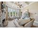 Inviting living room with a coffered ceiling, large windows, and comfortable seating arrangement at 3149 Hidden Falls Ne Dr, Buford, GA 30519