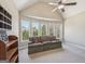Bright living room with vaulted ceiling, large windows offering natural light, and neutral-toned carpet at 3149 Hidden Falls Ne Dr, Buford, GA 30519
